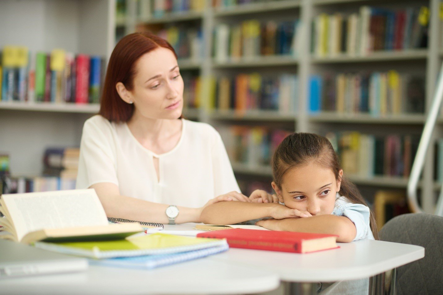 A teacher helping a child suffering for ADHD 